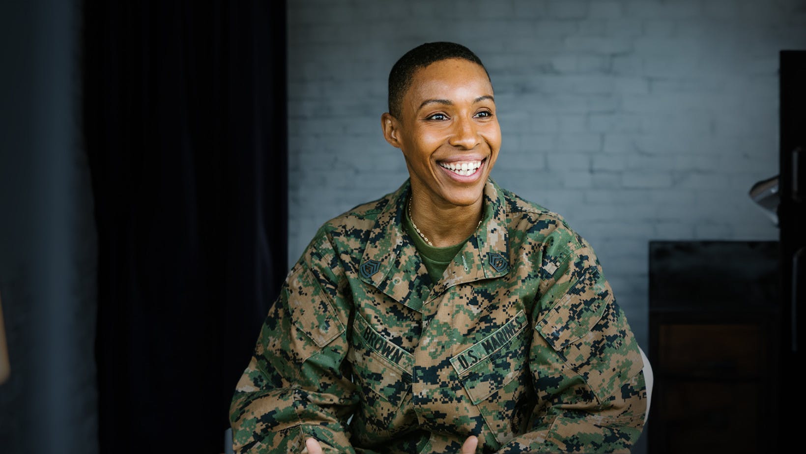 Female marine and veteran smiling 