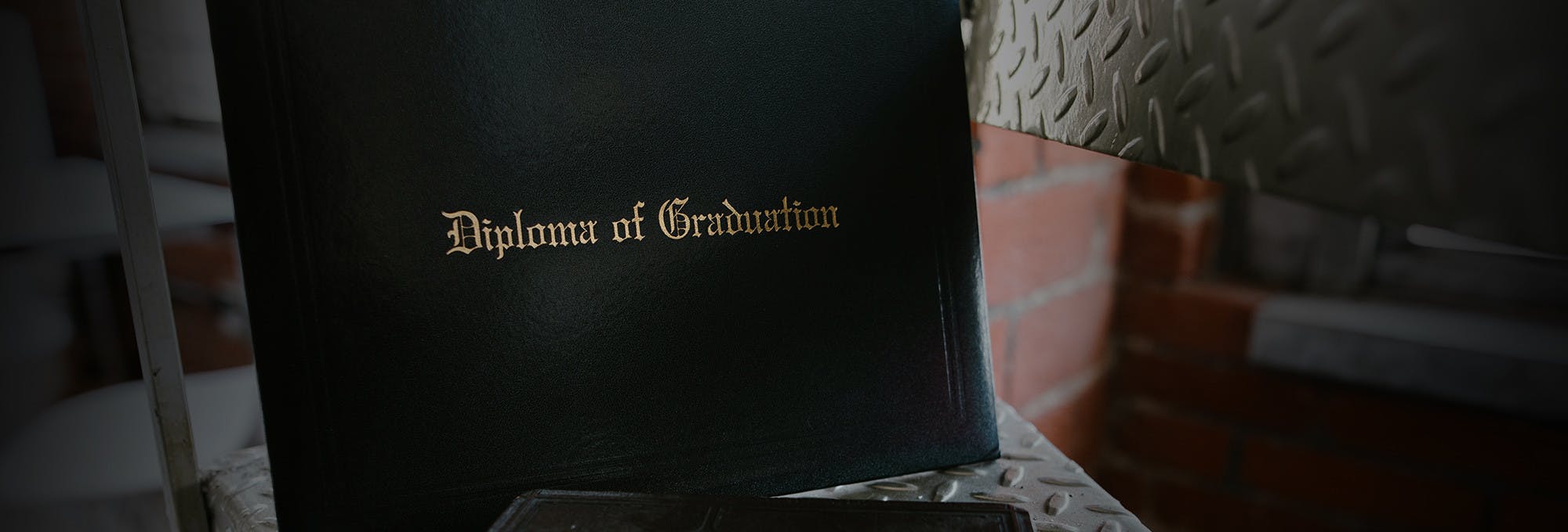 Diploma of graduation folder with a diploma inside