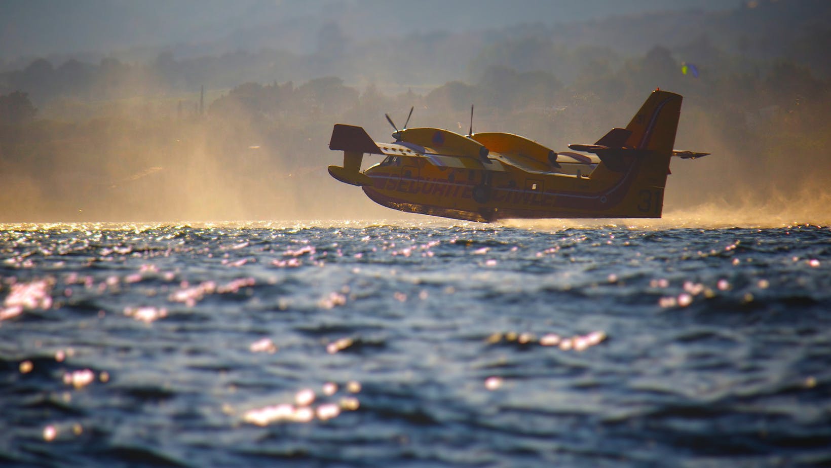 A sea plane flying right over the surface of water which represents the fundamental theorem of calculus