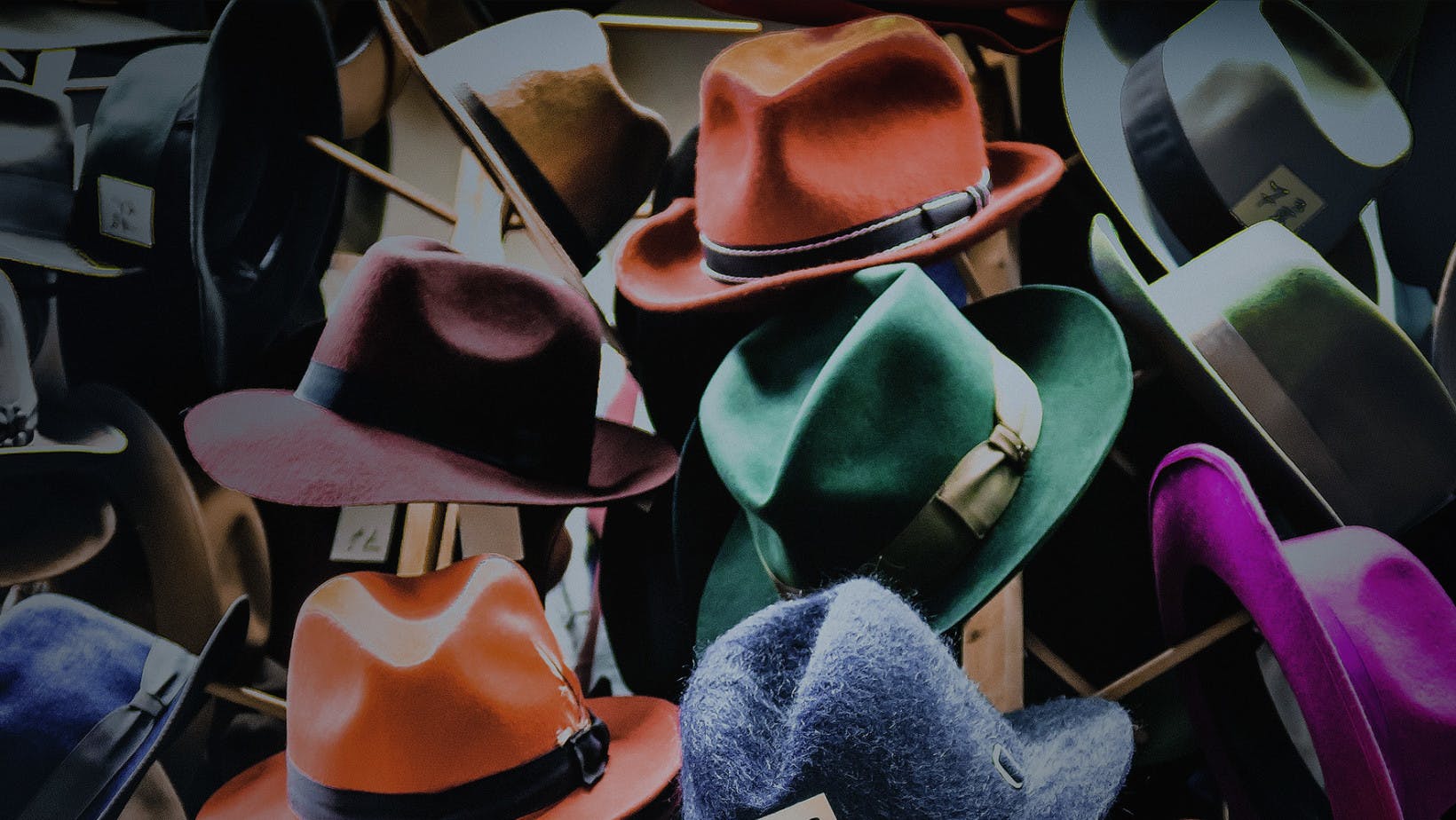 hats hanging on a hat rack representing supply and what is the law of supply