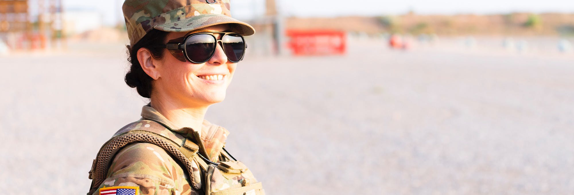 Female soldier smiling because the Army paid for her college